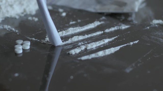 Close up of many drugs on the black table