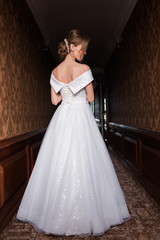 Bride.Young fashion model with perfect skin and make up  brown background  curly hair