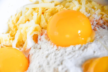 raw yolks lie on white flour cooking spices top view abstraction