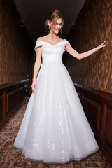 Bride wearing long wedding dress.