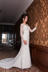 Bride wearing long wedding dress.