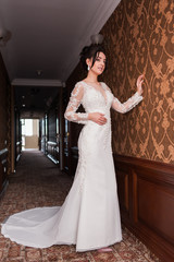 Bride wearing long wedding dress.