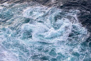 Background of the sea. Waves with foam top view