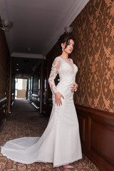 Bride wearing long wedding dress.