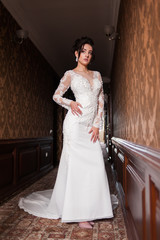 Bride wearing long wedding dress.