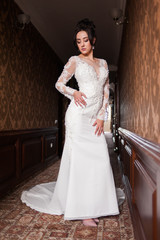 Bride wearing long wedding dress.