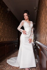 Bride wearing long wedding dress.