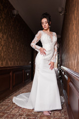 Bride wearing long wedding dress.