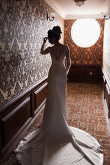 Bride wearing long wedding dress.