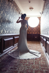 Bride wearing long wedding dress.