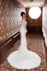 Bride wearing long wedding dress.