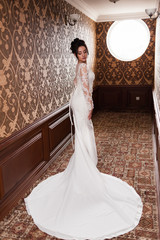 Bride wearing long wedding dress.