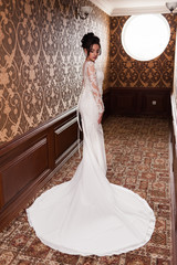 Bride wearing long wedding dress.