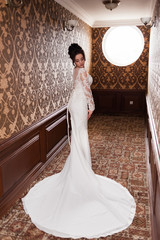 Bride wearing long wedding dress.