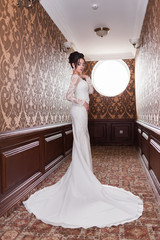 Bride wearing long wedding dress.