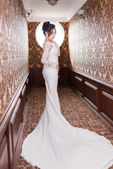 Bride wearing long wedding dress.