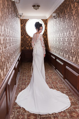 Bride wearing long wedding dress.
