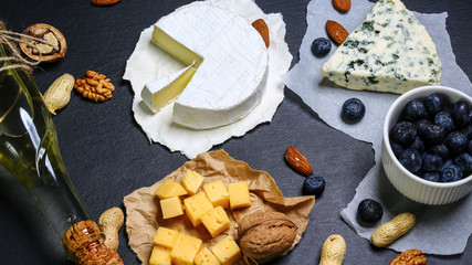 cheese board, cheese with blue mildew with berries, Camembert or brie cheese circle, top view image with copy space, set