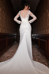 Bride wearing long wedding dress.