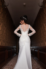 Bride wearing long wedding dress.