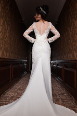 Bride wearing long wedding dress.