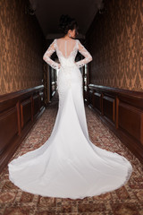 Bride wearing long wedding dress.