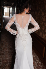 Bride wearing long wedding dress.