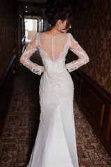 Bride wearing long wedding dress.