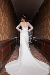 Bride wearing long wedding dress.