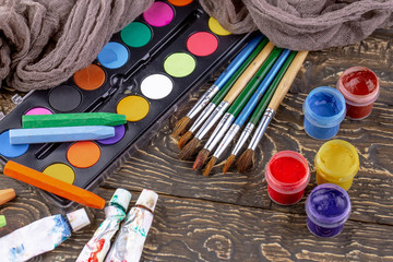 Paint brushes and paints for drawing.