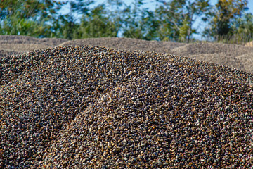 Piles of rubble in the production of concrete. Gravel for mortar-concrete node.