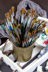 Paint brushes and paints for drawing.