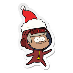 happy astronaut sticker cartoon of a wearing santa hat