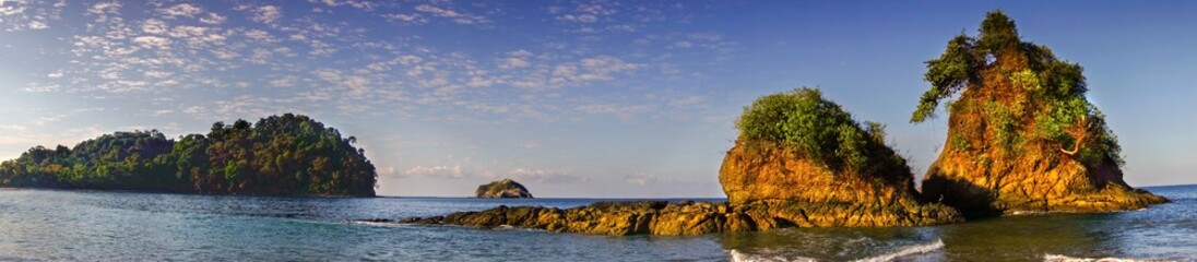 Wide Panoramic Landscape of Pacific Ocean Coastline and Small Islands on Manuel Antonio National Park Playa Espadilla Beach in Costa Rica