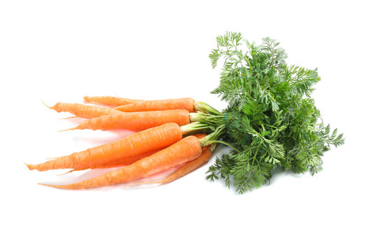 Ripe fresh carrots isolated on white background