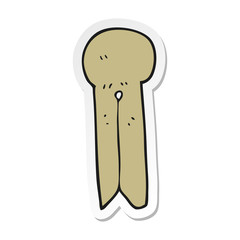 sticker of a cartoon old style wooden peg