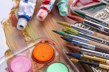 Paint brushes and paints for drawing.