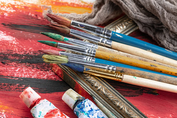 Paint brushes and paints for drawing.