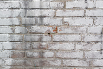Brick wall with silver Color sprayed on the surface