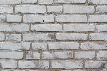 Brick wall with silver Color sprayed on the surface