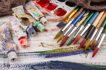 Paint brushes and paints for drawing.