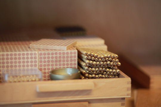Montessori golden bead material in a classroom