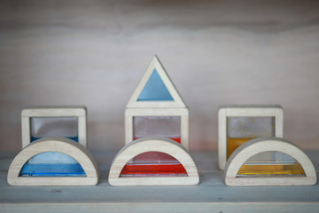 Wooden sensory toy blocks on a shelf