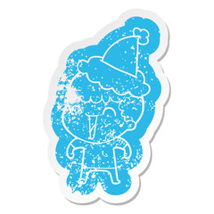 cartoon distressed sticker of a happy man wearing santa hat