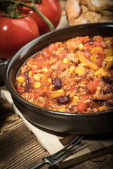 Chili con carne in a clay pan.