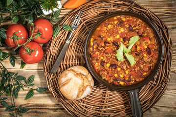 Chili con carne in a clay pan.