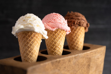 A Line of Three Classic Flavors of Ice Cream in a Wooden Sugar Mold