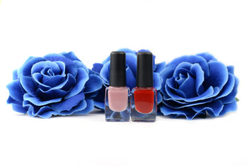 Obraz na płótnie Canvas red nail polish with a blue rose flower