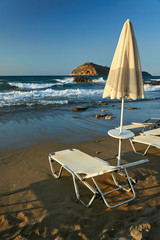 umbrella and sunbed on the beach on the island of Crete, Greece.