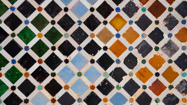 Tiled wall (azulejo) in the Nasrid Palaces (Palacios Nazar&iacute;es) of the Alhambra, Moorish art and architecture in Granada (Spain)